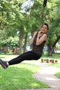 Thai adult beautiful girl relax and smile in the park