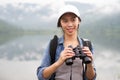 Thai adventure girl happy with her bird wathcing