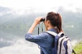 Thai adventure girl wathcing with binoculars