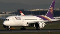 Thai Airways plane taxiing on runway