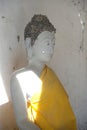 Thai ancient sitting white Buddha on a Thai Buddhist temple.