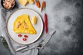 Thai Asian omelette, fresh red chilli, brown and white crabmeat, lemon, Cheddar cheese, eggs, on plate, on gray background, top