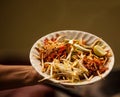 Thai Asian street fast food in hot pan, Pad Thai, or phad thai is a stir fried rice noodle dish commonly served as a street food Royalty Free Stock Photo