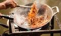 Thai Asian street fast food in hot pan, Pad Thai, or phad thai is a stir fried rice noodle dish commonly served as a street food Royalty Free Stock Photo