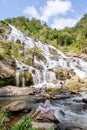 Thai Asian women visit Mae Ya Waterfall Doi Inthanon national park Thailand Chiang Mai Royalty Free Stock Photo