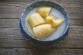 Thai banana in coconut milk with morning light on wooden background and copy space, Traditional conservative secret recipe