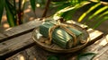 Thai banana in sticky rice, Khao Tom Mad, wrapped in banana leaves. Traditional Asian dessert on a plate. Concept of