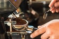 Thai Barista making a espresso with a coffee machine Royalty Free Stock Photo