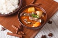 Thai beef massaman curry with peanuts and rice side dish Royalty Free Stock Photo