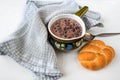 Thai black bean soup in rural bowl, bun and towel on white background, closeup Royalty Free Stock Photo