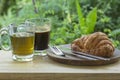 Thai Black Coffee and hot Tea with croissant bread on  Wooden Bar Royalty Free Stock Photo