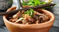 Thai bowl of beef noodle soup in clay pot with duck liver