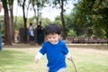 Thai boy with mom in the park Royalty Free Stock Photo