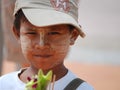 Thailand - A portrait of Thai boy, small child, with the whitening cream on his face