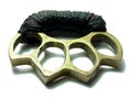 Thai brass knuckle-duster on white.