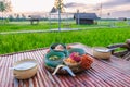 Thai breakfast with a green rice paddy field during sunrise