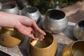 Thai Buddhist donate coin in monk's bowl