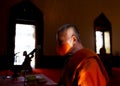 A Thai Buddhist monk wearing a facemask