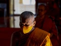 A Thai Buddhist monk wearing a facemask