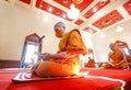 A Thai Buddhist monk wearing a facemask