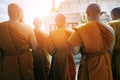 Thai buddhist praying and meditating in front of temple pagoda