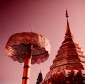 Thai buddhist temple doi suthep in pink sunset light, golden shine, details of decoration, on the hill above Chiang Mai