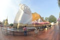 Thai Buddhists Paste gold leaf on the largest Reclining Buddha.