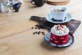 Thai Cake and coffee. Velvet red cake. Cookies decorated with red cake on wooden table and flower. strawberries morning. Delicious