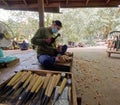 Thai carpenter carving wood in Temple of truth Pattaya