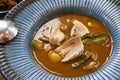 Thai chef cooking food fusion style cuisine white snapper boil with spicy hot red curry with ginger root and vegetables fruits on Royalty Free Stock Photo