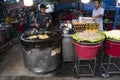 Thai chef cooking local food fried mussel with egg and crispy flour or cooked oyster omelette on pan for travelers people eat