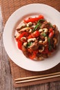 Thai chicken with vegetables and cashew close-up. vertical top v Royalty Free Stock Photo