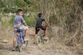 Thai children biking bicycle at Sritasala Cemetery Chinese grave