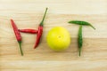 Thai chilii and lemon on wood background Royalty Free Stock Photo