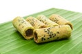 Thai coconut cracker roll on banana leaf.