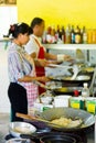 Thai cook at work in local restaurant