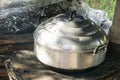 Thai cooking style, steam pot on vintage local fire-stove in kitchen of old wooden house Royalty Free Stock Photo