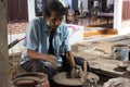 Thai craftsmanship technician or professional potter use machine work sculpture handmade pottery and handicraft earthenware in Koh