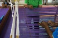 Thai craftsmanship technician professional use antique local wooden machine loom weaving hand woven cotton fabric for show Royalty Free Stock Photo