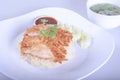 Thai crispy chicken served on steamed rice with sweet chilli sauce and cucumber slices. Traditional south east asian cuisine.and i Royalty Free Stock Photo