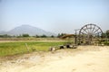 Thai Dam Cultural Village and big wooden turbine baler water wheel Royalty Free Stock Photo