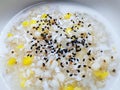 Thai Dessert with Barley and Bean in Coconut Milk and Black Sesame Topping