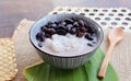 Khao Nioew Tua Dam - Thai dessert of Sweet Sticky rice with black beans in coconut milk - close up view