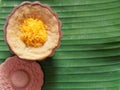 Thai dessert, egg custard with sweet sticky rice topped with golden threads, on banana leaf background Royalty Free Stock Photo