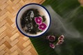 Thai dessert, Icevine, Pareira barva with coconut milk on wooden table, Top view Royalty Free Stock Photo