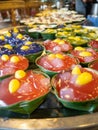 Thai Dessert name Tako colorful,Sweet taste made from materials coconut milk and sugar on banana leaf,At market Bangkachao Bangkok Royalty Free Stock Photo