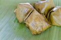 Thai dessert, Sticky rice with steamed custard, wrapped in banana leaves Royalty Free Stock Photo