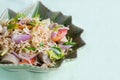 Thai dressed spicy salad with pork, tomatoes and noodle. Royalty Free Stock Photo