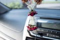 A Thai dried garland, a dried rose leaving in the car