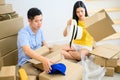 Thai entrepreneur couple are packing. Oline shopping and home delivery. Lock down and Self-quarantine for SME business Royalty Free Stock Photo
